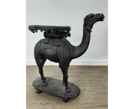 MIDDLE EASTERN CARVED WOOD TABLE,  modelled in the form of a camel  72cm high  50cm wide nose to tail. More images now online