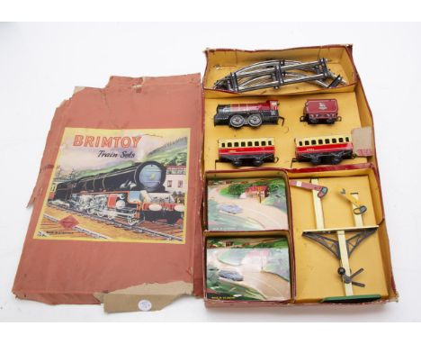 Two large Brimtoy 0 Gauge Clockwork Train Sets, set 813 comprising BR red 5060 0-4-0 Loco and tender, two red and cream coach