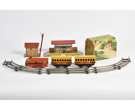An unboxed Brimtoy 0 Gauge clockwork Streamlined Train Set, with red/yellow locomotive 'The Prince' No 6220, two 1st class co