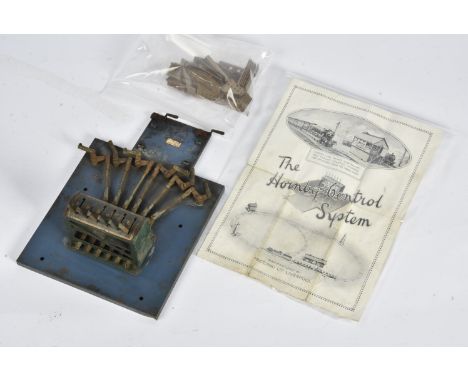 A Hornby 0 Gauge Control System Lever Frame and Rodding Guides, a 6-lever frame in green on blue base, with all rodding conne