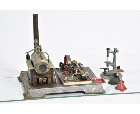 A Wilesco Stationary Steam Engine and Workshop Tools, the engine mounted on metallic grey base measuring 12" x 9½", with chro