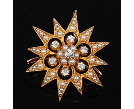 An early 20th century 18ct gold, seed pearl and diamond set snowflake pendant brooch, set with seven old cut diamonds, total 