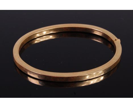 A 9ct hollow gold hinge bangle being square cut, undecorated, 11.7g, dia. 6.8cm   Condition Report / Extra Information  Hinge