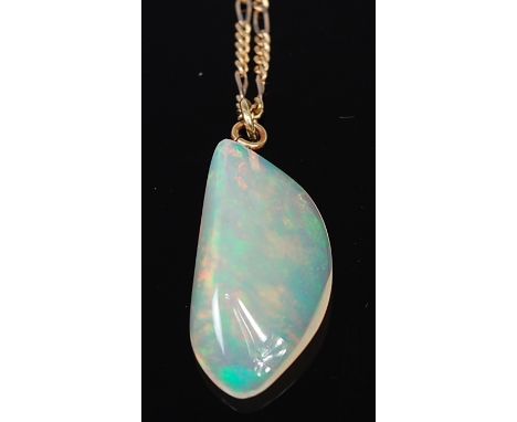 A polished opal pendant, weighing approx 15ct, on 14ct gold finelink neck chain, pendent h.3cm