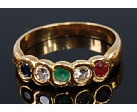 An 18ct gold and multi-gem set dress ring, arranged as ruby, diamond, emerald, diamond and sapphire in a line setting, each s