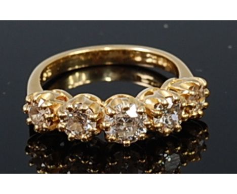 An 18ct gold diamond five stone ring, the graduated old cut diamonds claw set in a line, the centre stone weighing approx 0.6