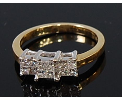 A modern 18ct gold and diamond dress ring, arranged as three groups of four square cut diamonds, total diamond weight estimat