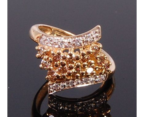 A modern 9ct gold multi-diamond set dress ring by QVC, arranged as four rows of small brilliants (one stone missing), 3g, siz