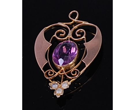 An early 20th century 9ct gold, amethyst and seed pearl set openwork pendant, of heart shape, 2.1g, 3.3cm    Condition Report