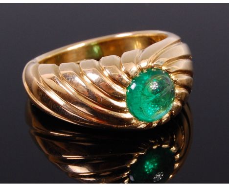 A 1940s 18ct gold and cabochon emerald set ring, later hallmarked, the emerald weighing approx 1.39ct, the heavy shank with f