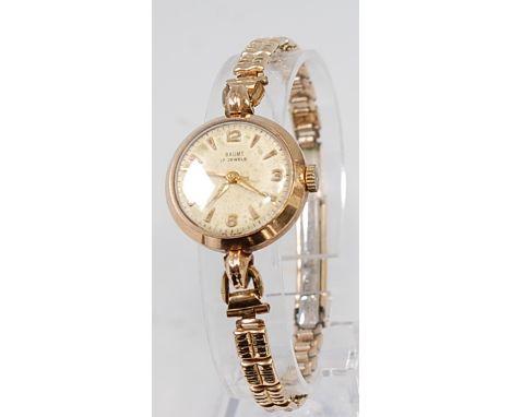 A Baume ladies 9ct gold cased wristwatch, having signed champagne dial, quarter Arabic numerals, and manual wind jewelled mov