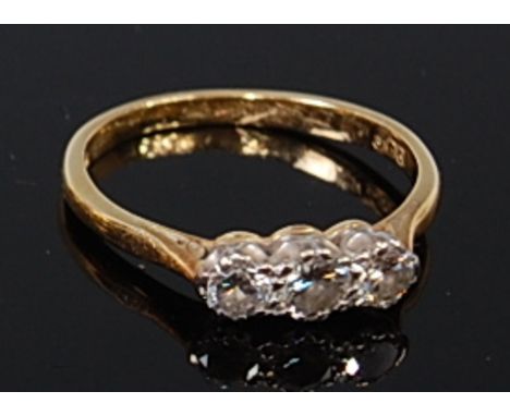 A Mappin & Webb 18ct gold diamond three stone ring, the centre brilliant cut diamond weighing approx 0.22ct, flanked to eithe