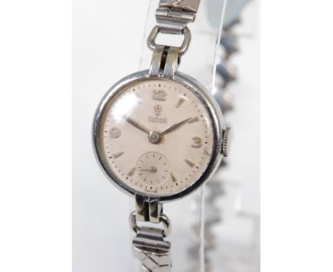 A vintage ladies Tudor steel cased wristwatch, having signed champagne dial, quarter Arabic numerals, subsidiary seconds dial