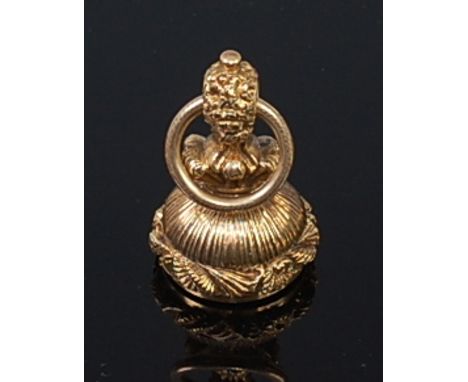A yellow metal and carved rock crystal(?) seal fob pendant, having chased rim, unmarked but tests as approx 14ct, gross weigh