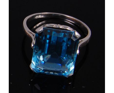 A white metal and aquamarine dress ring, the four claw set baguette aquamarine measuring approx 13 x 11 x 8mm, 4.4g, size J/K