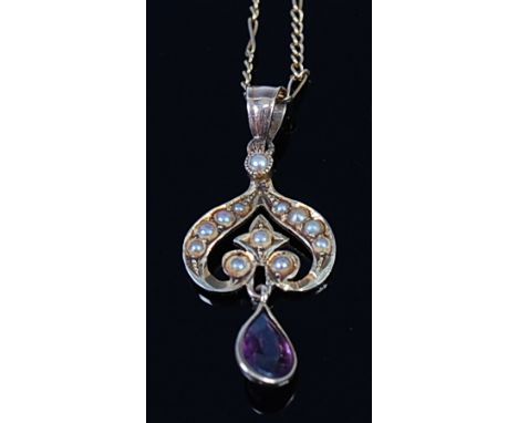 An Edwardian 14ct gold, amethyst and seed pearl set pendant, 2.3cm (excluding bale), on 10ct gold finelink neck chain, 2.9g