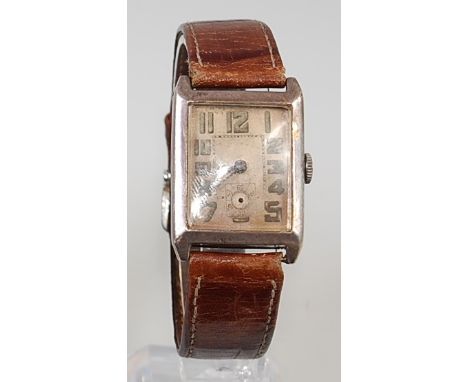 An Art Deco gents silver cased tank watch, the unsigned dial with luminous Arabic numerals, subsidiary dial (lacking hand), a