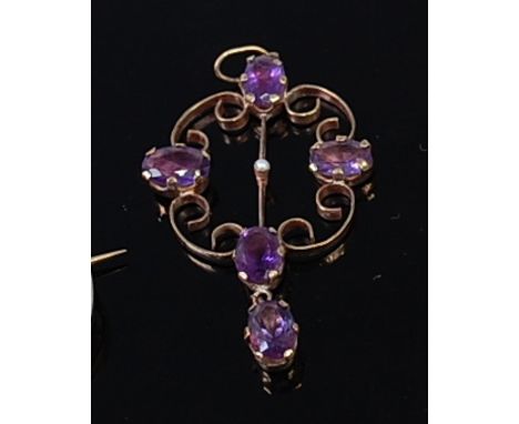 A George V 9ct gold and amethyst set openwork pendant, further centre set with a tiny seed pearl, 1.7g, 3.5cm