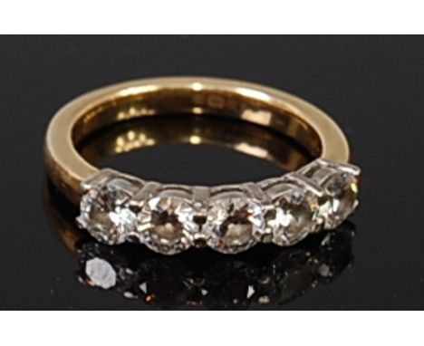 An 18ct yellow gold and diamond five stone ring, the round brilliant cut diamonds in a line setting, with IGI report No. F3C9