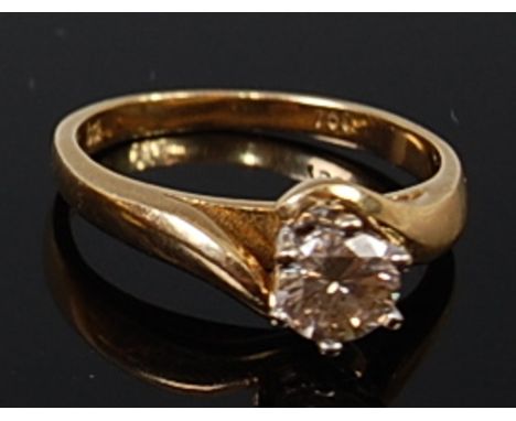 An 18ct gold diamond solitaire ring, the claw set brilliant weighing approx 0.6ct, 3.8g, size K