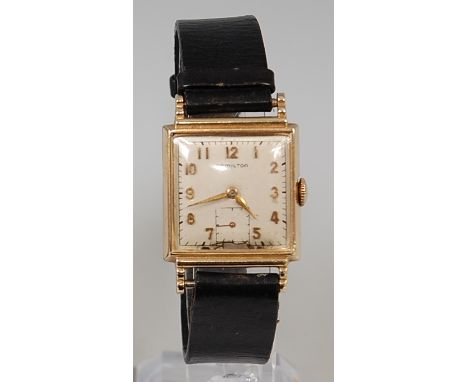 A gents Hamilton 14ct gold cased dress watch, having signed square dial with raised Arabic numerals, subsidiary seconds dial,