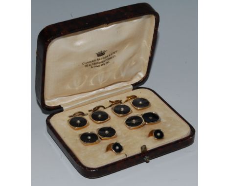 A cased gents 18ct gold backed dress set comprising four buttons, pair cuff links, pair collar studs, each black enamelled an