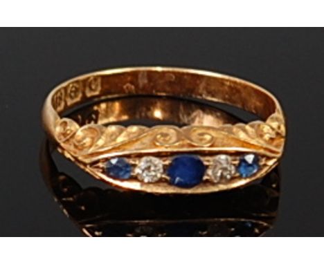 An 18ct gold, sapphire and diamond dress ring, the round cut and old cut diamonds in a boat setting, 2.9g, size N 