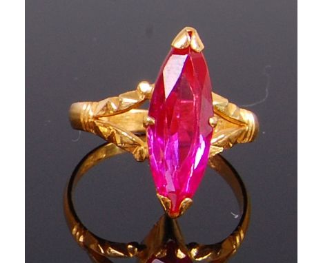 A Far Eastern high carat yellow gold and pink sapphire set dress ring, as a four claw set marquise cut sapphire, 3.6g, size N