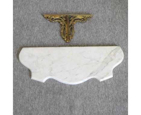 A marble wall shelf, with brass brackets, 74cm