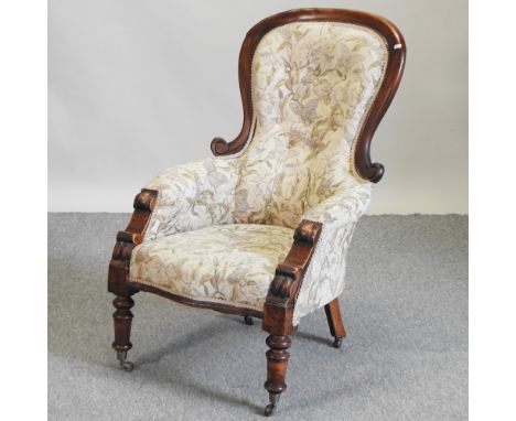 A Victorian cream floral upholstered button back armchair