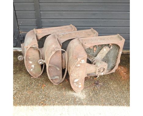 A mid 20th century Fordson tractor radiator, together with two others