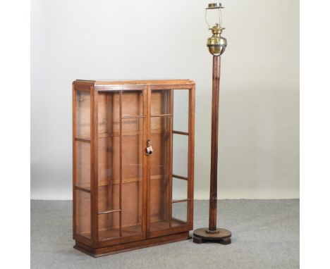 An early 20th century oak display cabinet, 88cm, together with an oak standard oil lamp