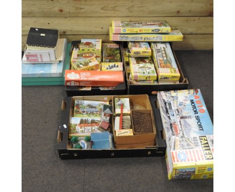 Five boxes of OO and HO gauge model railway accessories, some boxed, together with a collection of vintage board games