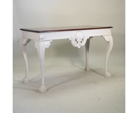 A large hand-made George II style console table, with a mahogany top, on a carved and cream painted base, with a Greek key fr