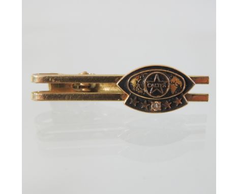 A gentleman's Caltex gold and gold plated enamel tie pin, 4.5cm