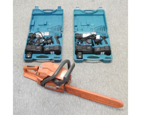 A collection of tools, to include a chainsaw and drills