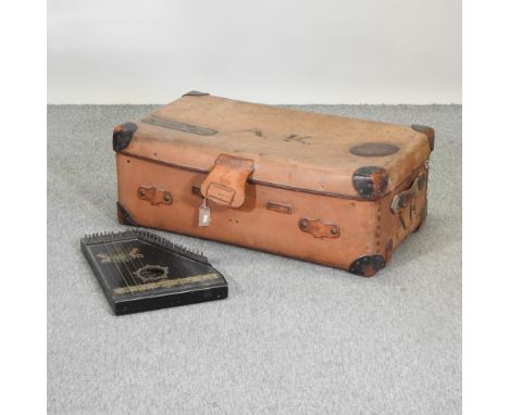 A leather trunk, 91cm, together with a zither