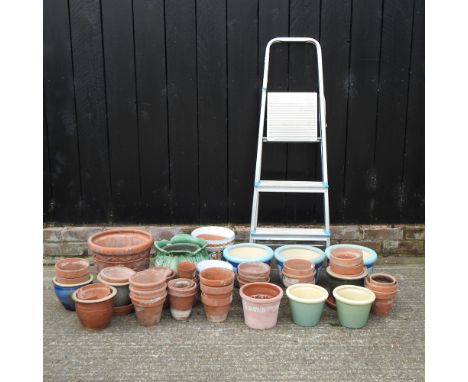 A collection of various garden pots, together with a small step ladder