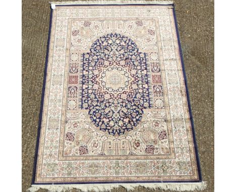 A Keshan style carpet on a blue ground, 230 x 160cm