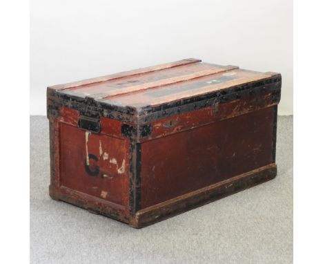 A wooden and metal bound trunk, 91cm