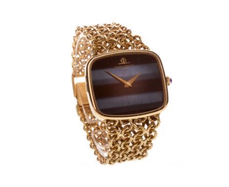 GENTLEMAN'S BAUME &amp; MERCIER EIGHTEEN CARAT GOLD MANUAL WIND WRIST WATCH, the rounded rectangular banded effect black and 