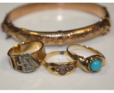 THREE NINE CARAT GOLD RINGS AND A NINE CARAT GOLD BANGLE
comprising of a turquoise set ring, s pearl set ring, and a buckle m