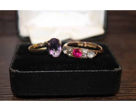 NINE CARAT GOLD AMETHYST RING AND A NINE CARAT GOLD WHITE AND RED GEM SET RING
the amethyst ring marked 9ct to the inner band