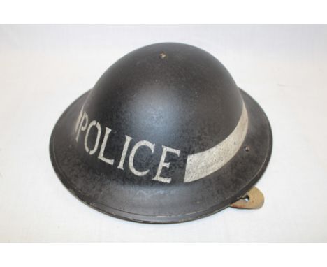 A Second War British Home Front steel MKII Police helmet complete with liner and chin strap 