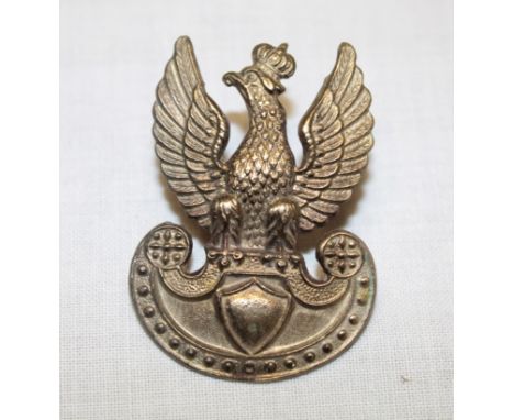 A Second War Polish Army silver-plated cap badge, the reverse marked "P" 