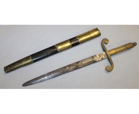 An unusual dirk with 9½" double edged blade, horn mounted brass hilt in brass mounted leather scabbard