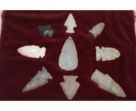 A display of 9 various Neolithic flint arrow heads etc 