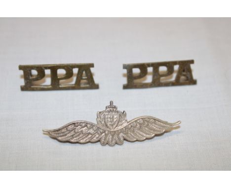 A pair of Second War Popski's Private Army brass shoulder titles and a silver parachute wings by Spencer of London