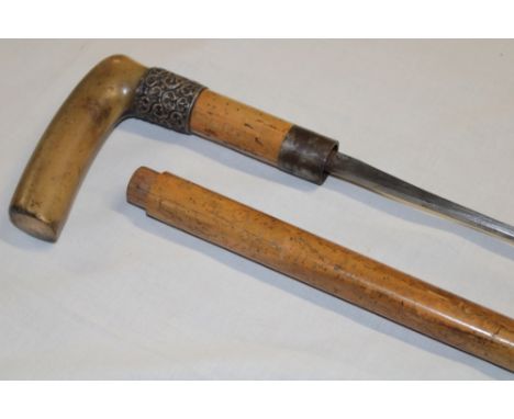 A Gentleman's sword stick with 29" square-section blade in malucca mounts with silver collar and horn handle 