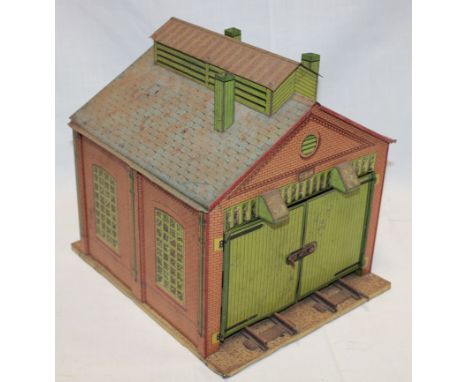 A Hornby 0 gauge tinplate engine shed 